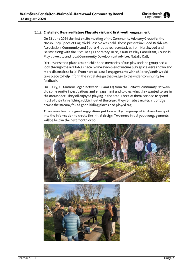 A group of people standing in a park

Description automatically generated