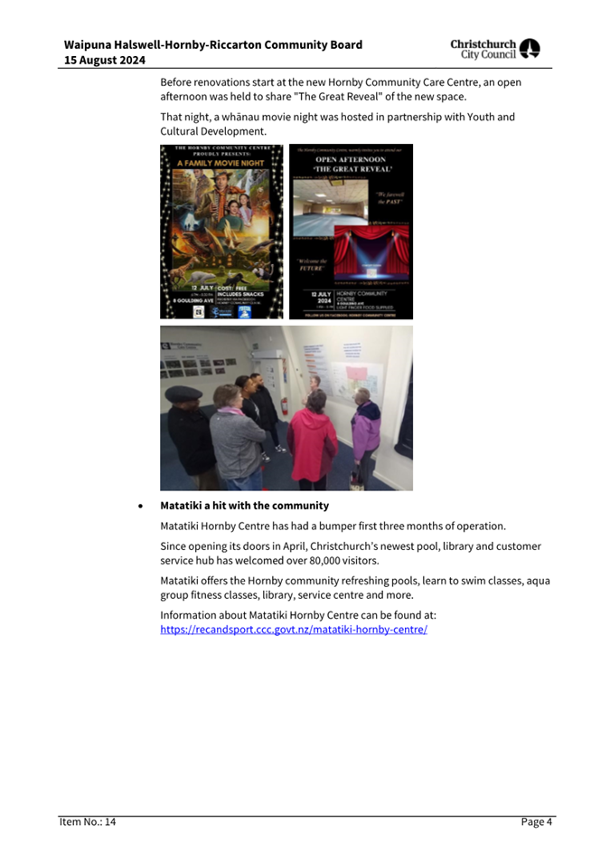 A group of people looking at posters

Description automatically generated