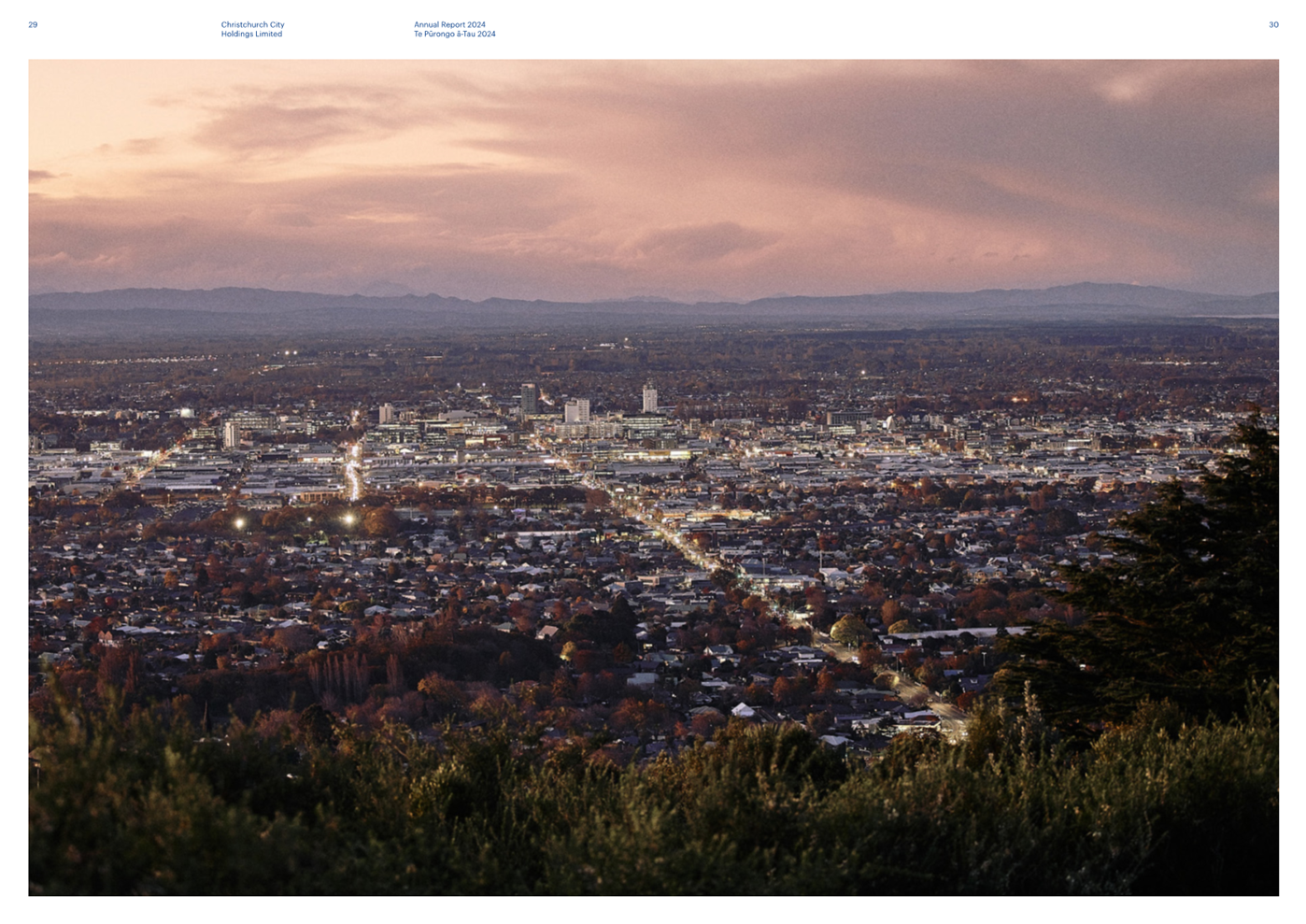 A cityscape with trees and clouds

Description automatically generated
