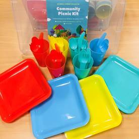 An image of colorful plastic picnic utensils and plates.
