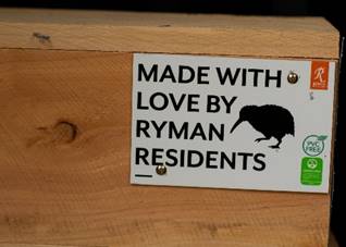 A white sign with black text on it

Description automatically generated