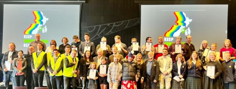 A group of people holding papers

Description automatically generated