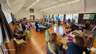 A group of people in a room

Description automatically generated