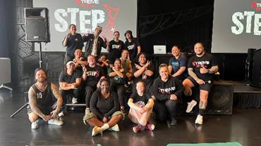 A group of people posing for a photo

Description automatically generated