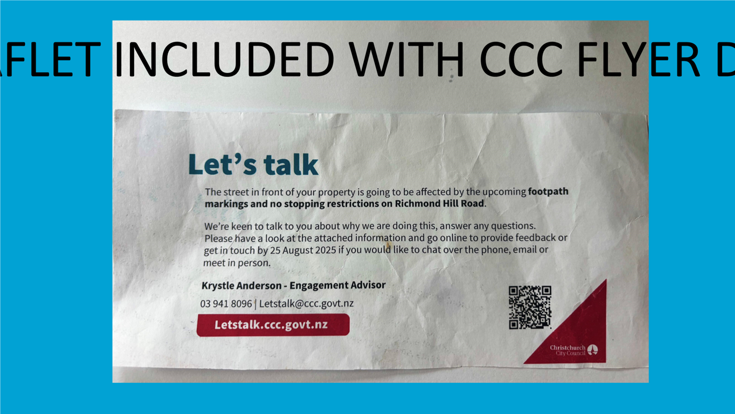 A white envelope with red and blue text

Description automatically generated