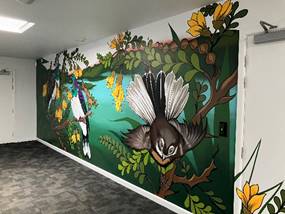 A wall with birds and flowers

Description automatically generated