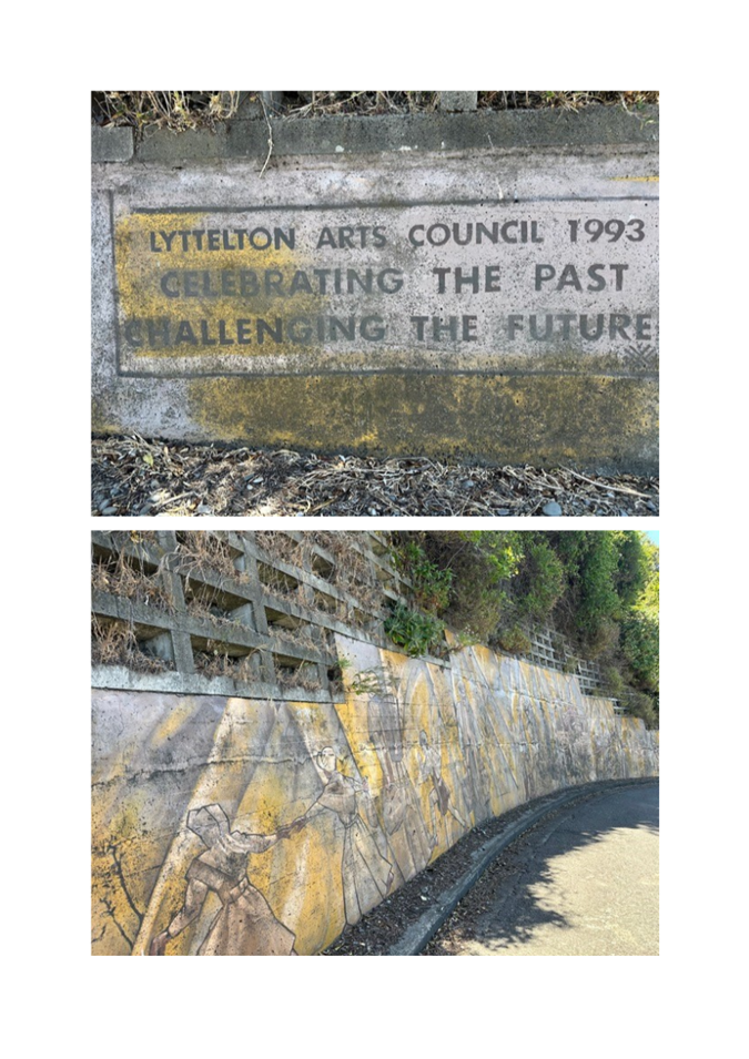 A wall with a sign and a wall with a picture of a person on it

Description automatically generated with medium confidence