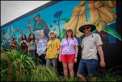 A group of people posing for a photo

Description automatically generated