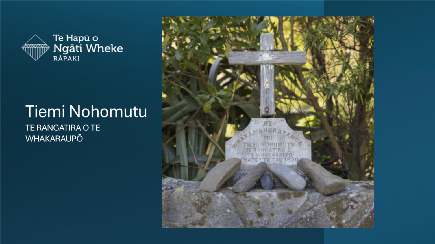 A stone cross on a rock

Description automatically generated