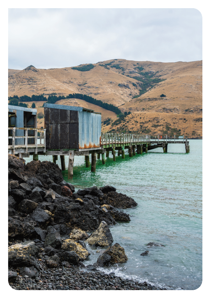 A dock with a building on the water

AI-generated content may be incorrect.