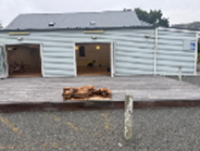 A building with a wood deck

Description automatically generated