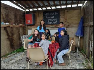 A group of people sitting at a table

Description automatically generated