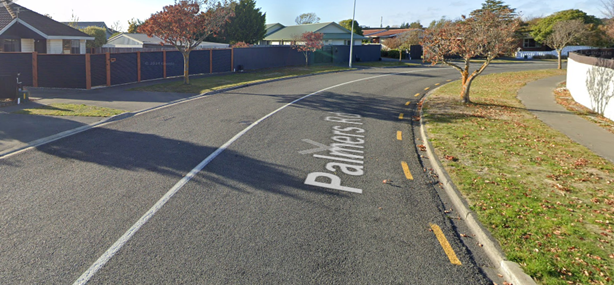 A road with white text on it

Description automatically generated