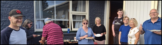 A group of women standing outside a house

AI-generated content may be incorrect.