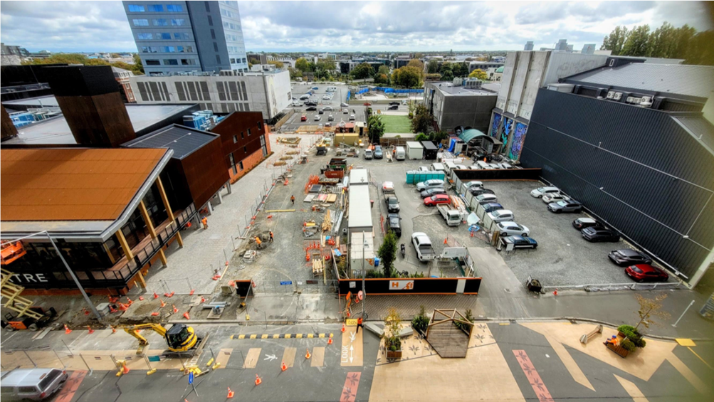 A construction site with cars and buildings

AI-generated content may be incorrect.