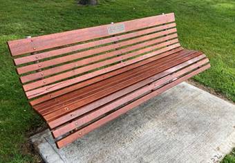 A wooden bench in a park

AI-generated content may be incorrect.