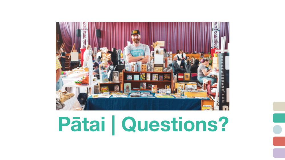 A person standing behind a table with other people

AI-generated content may be incorrect.