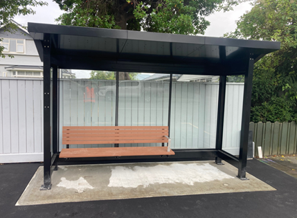 A bus stop with a bench

AI-generated content may be incorrect.