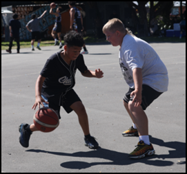 A child playing basketball with another child

AI-generated content may be incorrect.