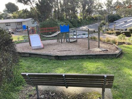 A playground with a swing and a bench

AI-generated content may be incorrect.
