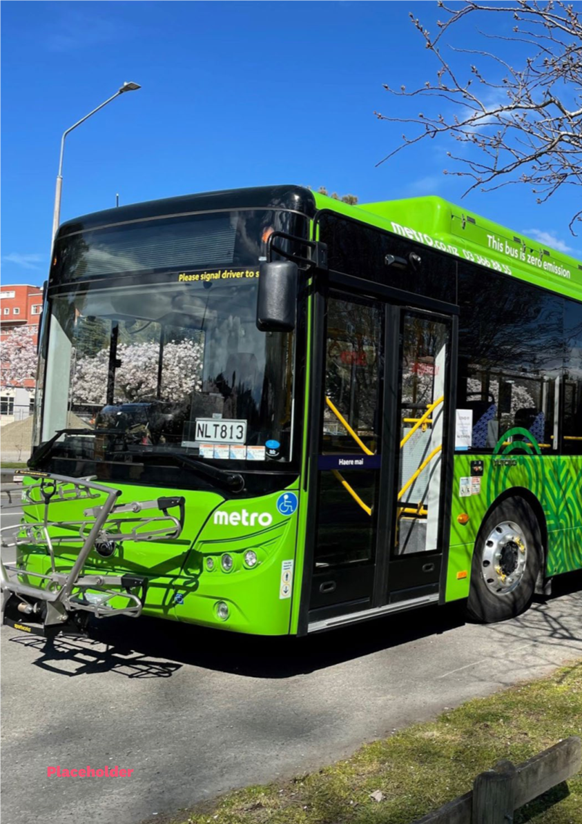 A green bus parked on the side of a road

AI-generated content may be incorrect.