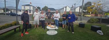 A group of people standing in a yard

AI-generated content may be incorrect.