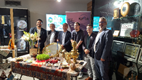 A group of men standing in front of a table with a candle and a mirror

AI-generated content may be incorrect.