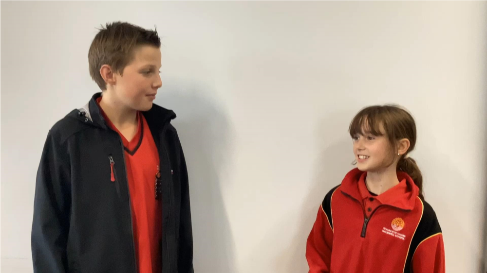 A child and child standing next to each other

AI-generated content may be incorrect.