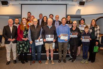 A group of people holding signs

AI-generated content may be incorrect.