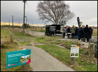 A group of people standing around a food truck

AI-generated content may be incorrect.