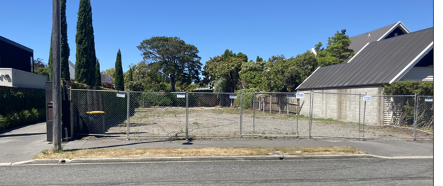 A fenced area with trees and a house

AI-generated content may be incorrect.