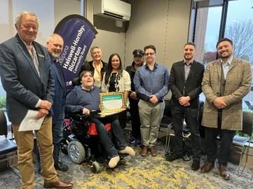 Waipuna Halswell Hornby Riccarton Community Boad members and Graffiti Programme staff with Brodie Murray and his Community Service Award certificate.