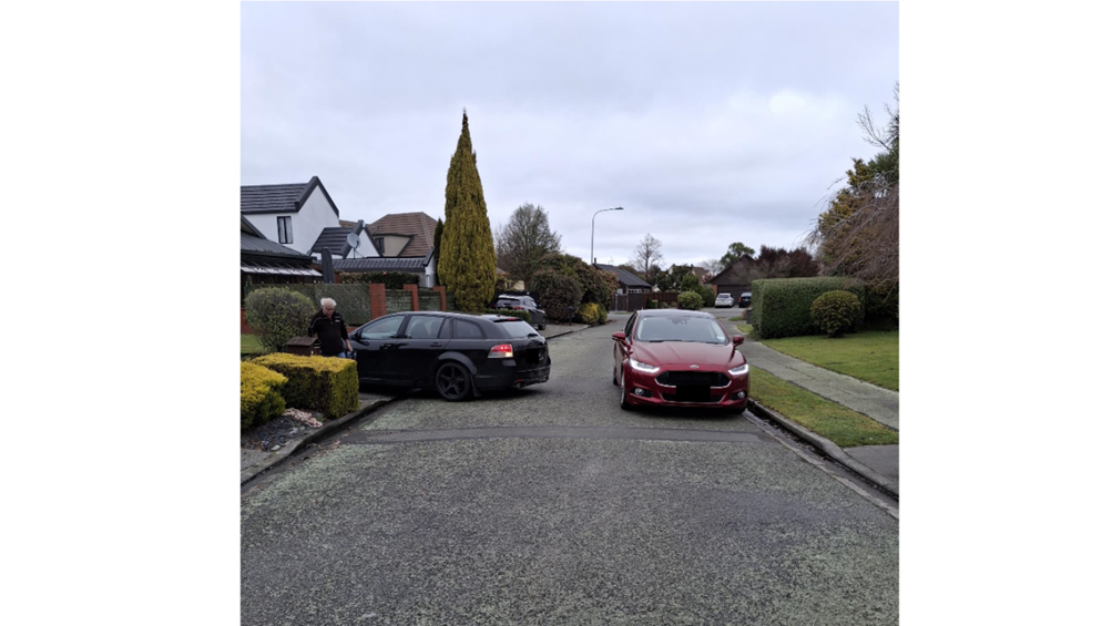 A couple of cars parked in a driveway

AI-generated content may be incorrect.