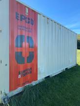 A white container with a red sign on the side

AI-generated content may be incorrect.