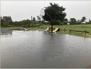A playground with a basketball hoop and a basketball hoop

AI-generated content may be incorrect.