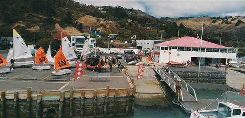 A group of boats on a dock

AI-generated content may be incorrect.