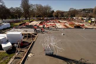 A construction site with workers on the roof

AI-generated content may be incorrect.