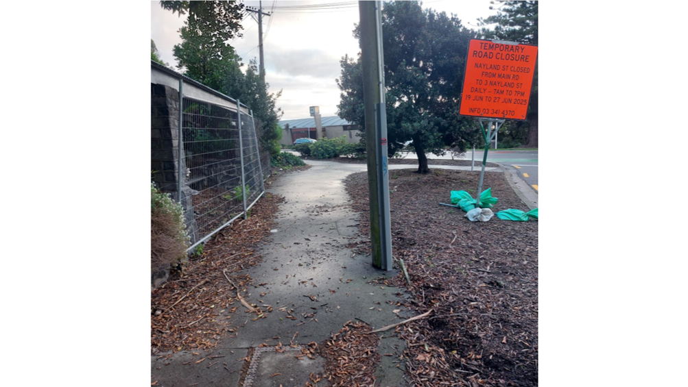 A sign on a sidewalk

AI-generated content may be incorrect.