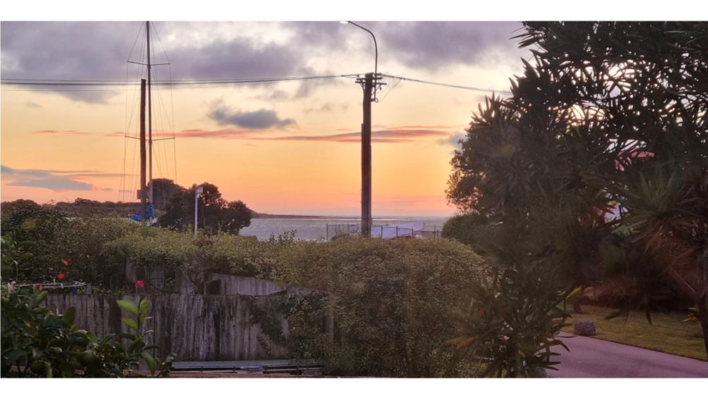 A sunset over a body of water

AI-generated content may be incorrect.