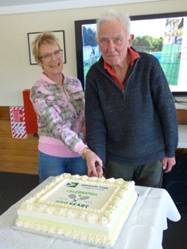 A person and person cutting a cake

AI-generated content may be incorrect.