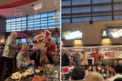 Photograph featuring a traditional lion dance performance interacting with seated guests at a banquet table with food and drinks. The second photograph shows a group of people standing and speaking in front of a banner reading "Canterbury Malaysian Society Incorporated," with attendees seated at tables.